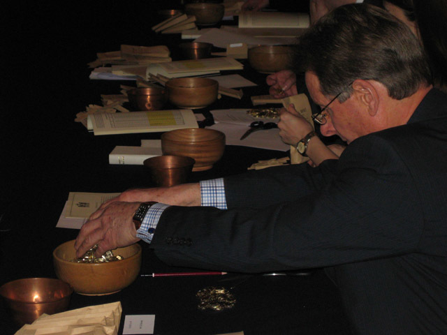Coins are counted into a wooden bowl, with one coin from every sample placed in the copper bowl for further testing. 
