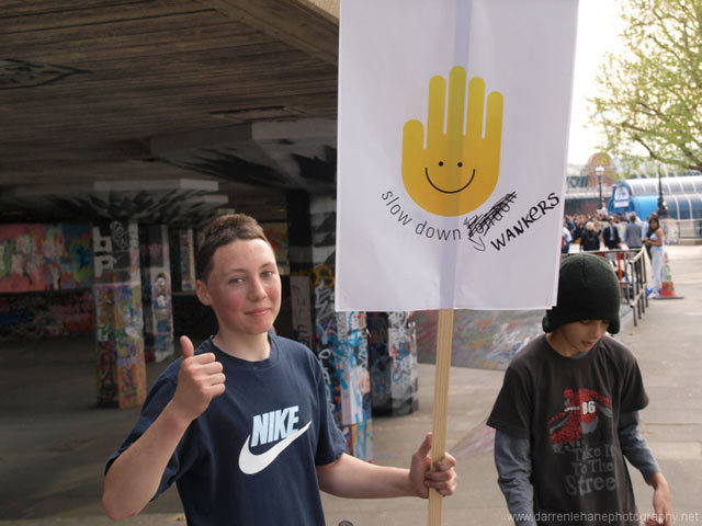 We should point out that these two boys were not part of the event, they just managed to get their hands on a placard and made their own alterations to it. By Darren Lehane.  