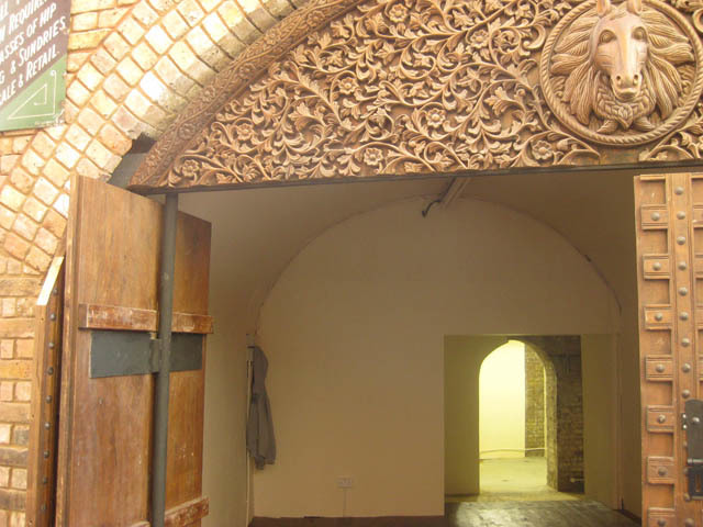 Peering inside one of the new shop units, to the south of the Stables beneath the railway. Note the elaborate wooden carving, reminiscent of the craftwork in the Gilgamesh building. 