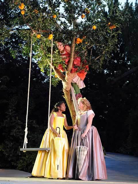 Samantha Spiro (Beatrice) overhears Anneika Rose (Hero) and Sarah Ingram (Ursula) praising Benedick at Regent's Park Open Air Theatre. Photo by Alistair Muir