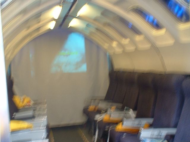 Aircraft cabin interior, blurred not by turbulence but by inept photographer / diner 