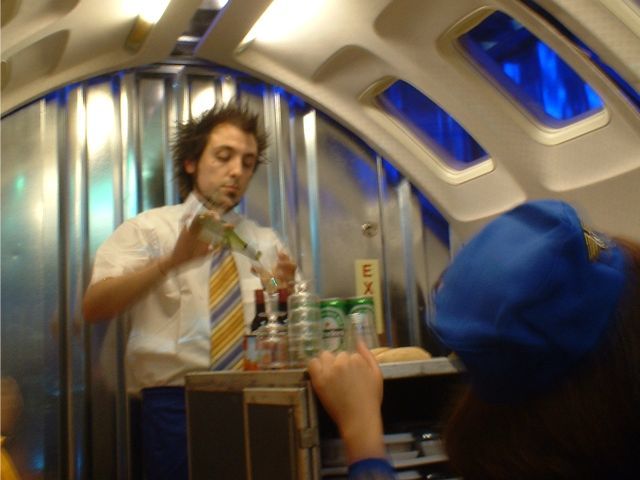 Richard Dedomenici serves drinks from the trolley 