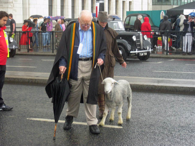 One man and his sheep. An unusual sight, but we're more intrigued by the sinister gentleman behind them. 