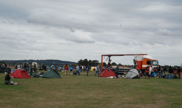 A lorry parked on a marked out 'road', loaded with materials to build camp infrastructure / image by Rachel H