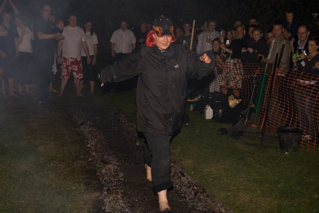 The first person braves the coals 
