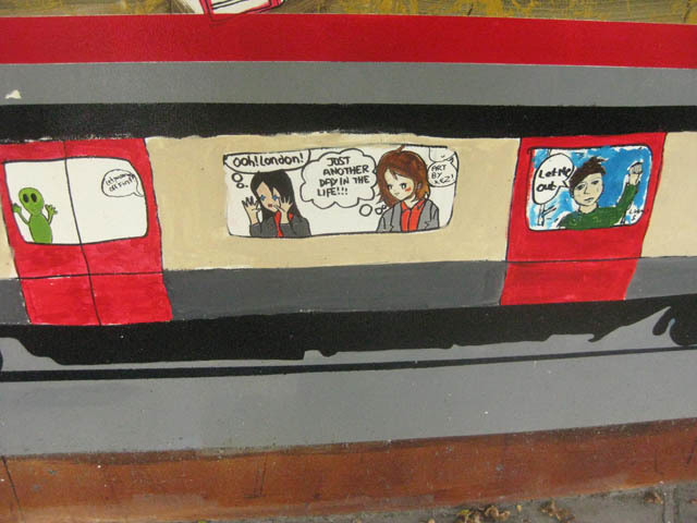 Tube passengers (including one of many aliens in the mural) are universally disgruntled. 
