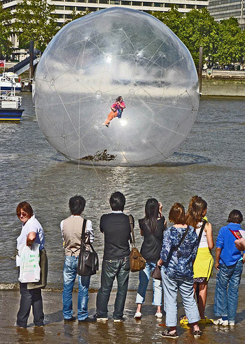 Man playing flute in a bubble (Where The Art Is) 