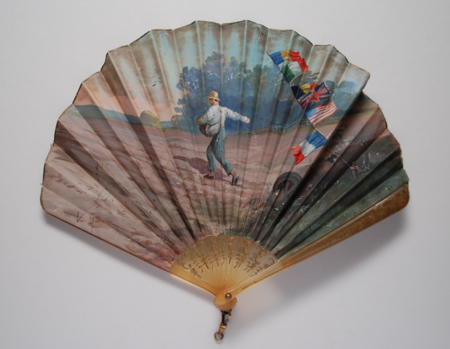 Horn fan, the leaf painted with a man sowing seed in a field still displaying signs of war. Signed van Garden. French, c. 1918/19 