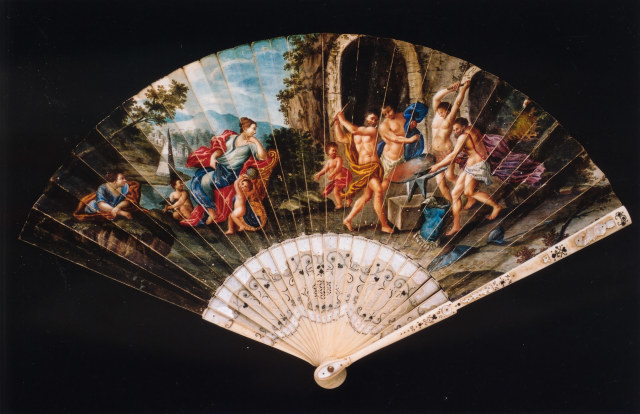 Ivory and mother-of-pearl fan with vellum leaf painted with a scene of Venus watching Vulcan forge weapons. Probably Italian, c. 1700-20 