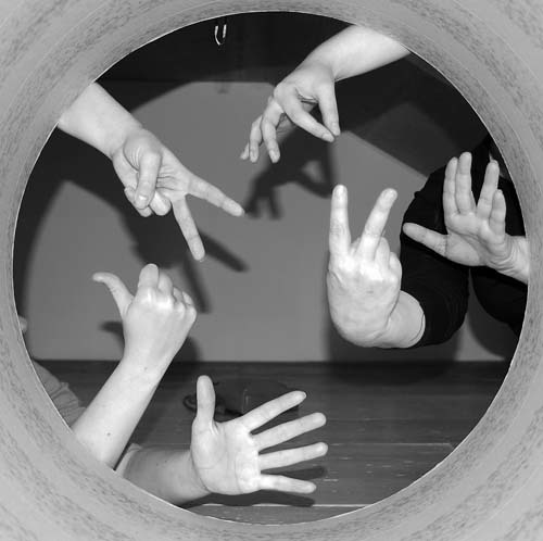 Team hand symbols through an installation at 56 Artillery Lane Team Londonistas