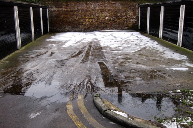 Tyre tracks in thawing snow
