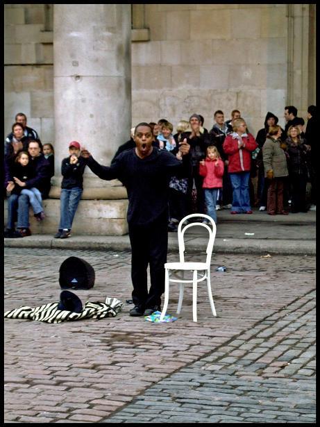 Suspended animation in Covent Garden - a street performer plies his trade.