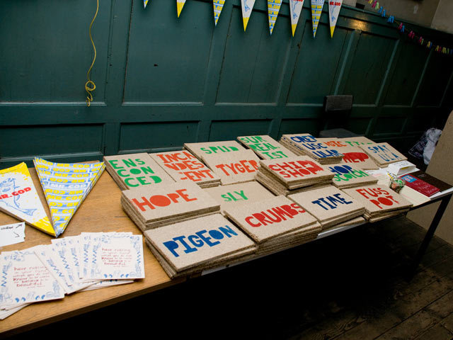 The Henningham Family Press 'Chips' printed during the Chip Shop project at the right end of the table. On the left, two prints from 'Keep Printing and Carry On'. Top is 'Mr Cod/God', a Sister Corita Print made by Murray Macaulay; bottom is a Phillip Morris quote designed by Jo Neary. Alex Muller