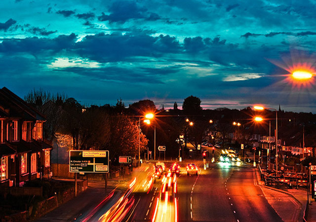 street lights, clouds, traffic lights and the hint of a sunset