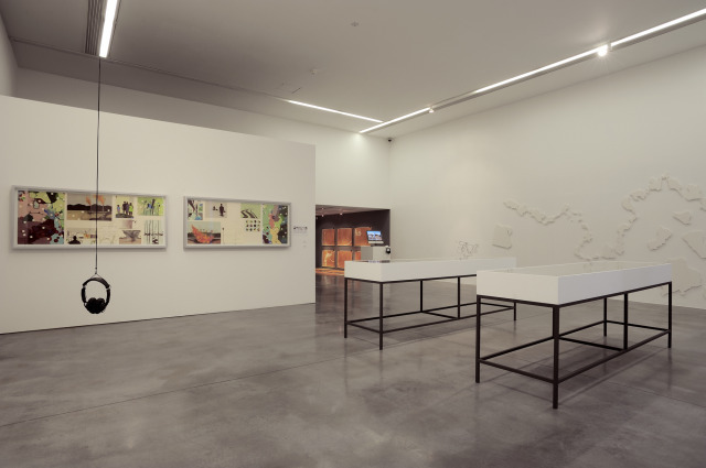 The downstairs room showing various works.