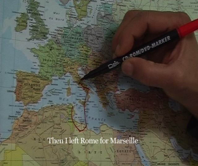 The film installation by Bouchra Khalili shows migrants plotting out their travels, with commentary.