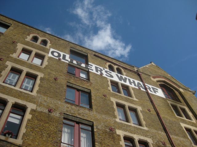 One of the first riverside warehouses to be converted into modern apartments overlooks the site.
