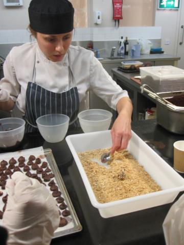 Our chef/tutor Lucy coating a truffle.  She's a great advert for apprenticeship schemes: passionate, professional and ambitious.