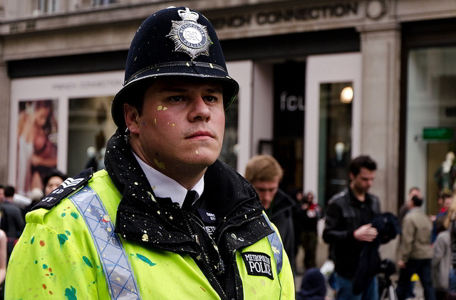 Paint-spattered policeman at Oxford Circus / paulµ43 from the Londonist Flickr pool