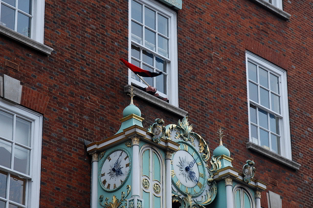 An anarchist flag waves from Fortnum and Mason at the start of the UK Uncut occupation / Tom Royal, with permission