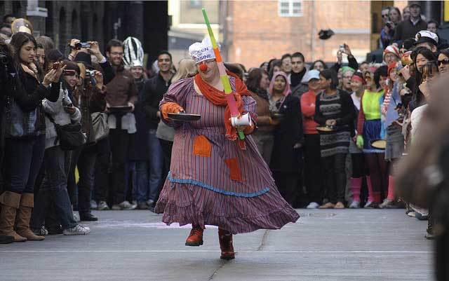 The Mistress of Ceremonies does a demo run at the Great Spitalfields Pancake Race by olliepix