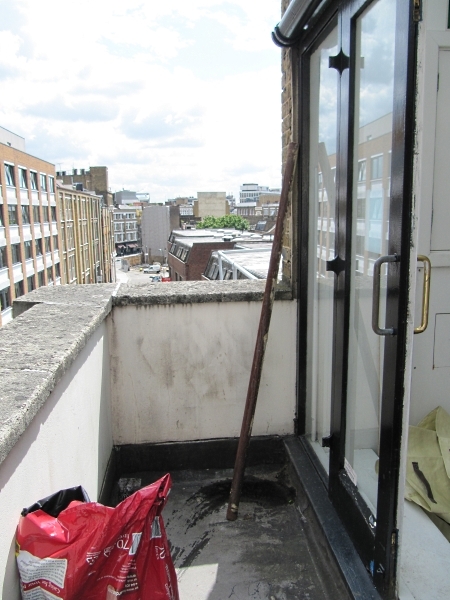 Before: empty space and a rusty pole