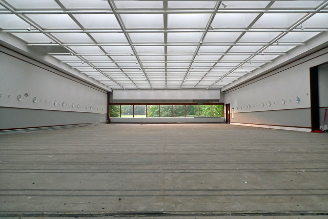 The gallery. On the walls are a number of plates featuring the likeness of The Queen