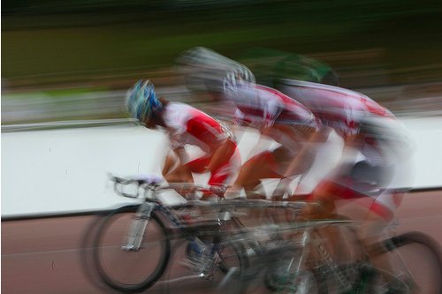Riders pass Buckingham Palace at the finish by Mark Baynes