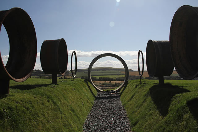 Charles Jencks: The Avenue of Doubles focuses through a sewer pipe on a volcano 375 million years old © Charles Jencks