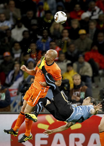 1st Prize Sport Single: Mike Hutchings, South Africa, for Reuters. Netherlands Demy de Zeeuw is kicked in the face by Uruguay’s Martin Cáceres during World Cup semi-final, Cape Town, 6 July