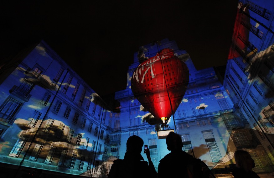 EMBARGOED TO 0001 WEDNESDAY JANUARY 11.

A  270 degree fully immersive 3D projection for Virgin Money appears at the University of London's Senate House Library courtyard to launch the company's '40 Years of Better. Now in a bank' campaign. 
PRESS ASSOCIATION Photo. Picture date: Tuesday January 10, 2011.
Virgin Group chairman Sir Richard Branson kicked off the three minute projection which told the Virgin story from space travel, trains, records, Virgin Atlantic planes and hot air balloons to a Virgin Money branch in front of audience of around 200. 
Photo credit should read: David Parry/PA Wire