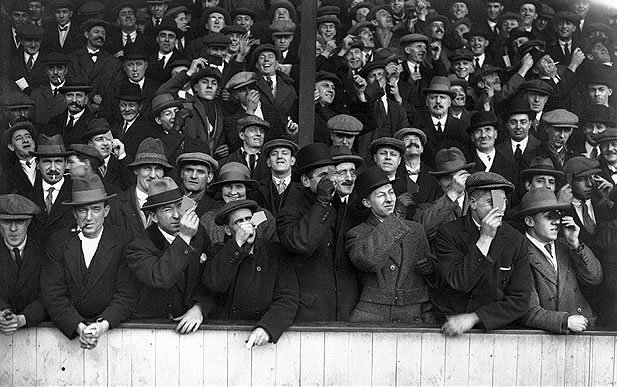 Soccer Eclipse: 4 April 1936: Spectators at Upton Park to see the football match between West Ham United and Aston Villa take a moment to view the eclipse of the sun during play (Photo by Topical Press Agency/Getty Images)