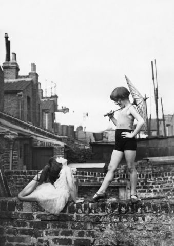 Back Garden Cabaret: Two young ballet dancers, Violet Hutchinson aged 8, and Betty Putt aged 7, rehearsing in a back garden in Poplar, east London. (Photo by Fox Photos/Getty Images) 