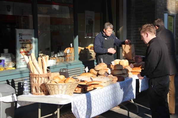 Selling bread in the sun down Borough Market way by Tim Woodall