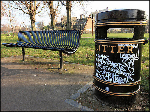 Sharing park space with amusing graffiti bin, by artofthestate