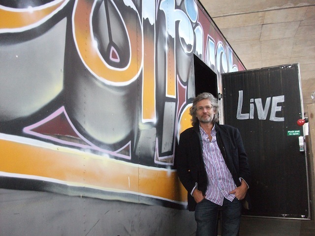 John Cierach stands beside the container.