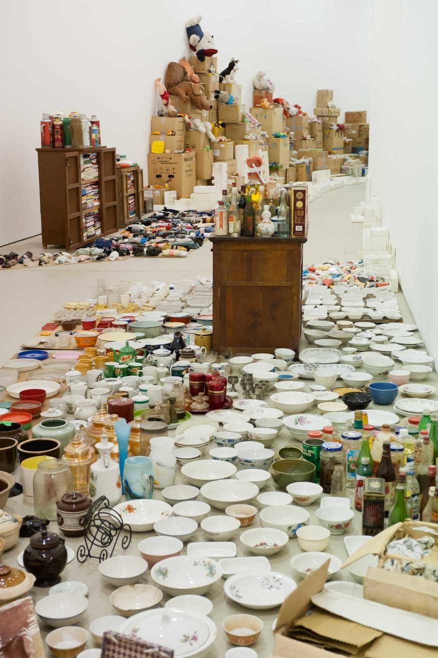 London, UK. 14/02/2012. Song Dong: Waste Not. Celebrated Chinese artist, Song Dong, is known for his conceptual, personal, performances and installations. For his first solo exhibition in a major UK public gallery, Song Dong is installing the monumental work, Waste Not, in The Curve, Barbican Art Galery. Comprising over 10,000 items collected by Song Dong's mother over five decades - ranging from a section of the house to metal pots and plastic bowls to blankets, bottle caps, toothpaste tubes and toys - the installation is a tribute to his mother, as well as a meditation on family life. Photo credit: Jane Hobson