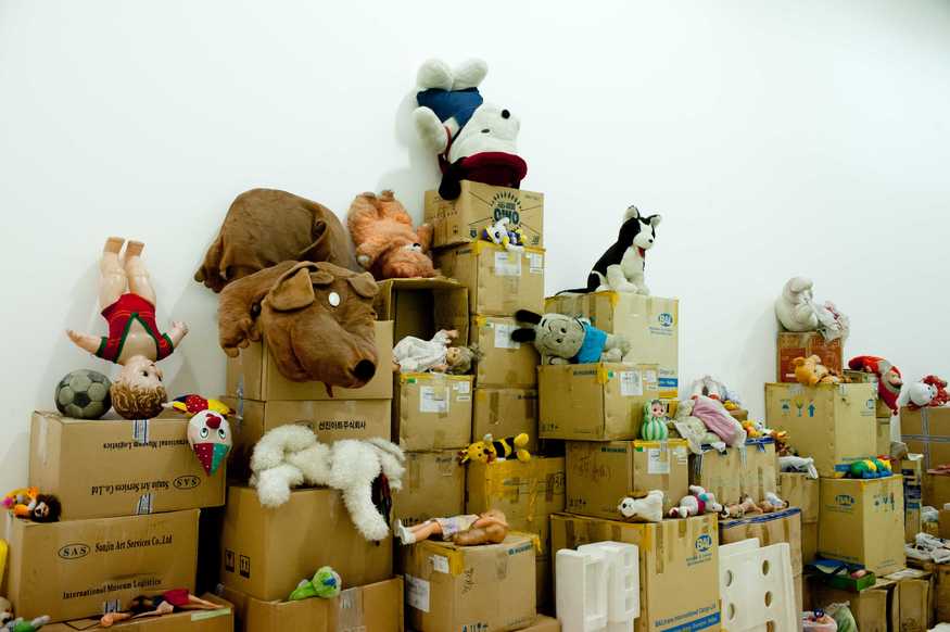 London, UK. 14/02/2012. Song Dong: Waste Not. Celebrated Chinese artist, Song Dong, is known for his conceptual, personal, performances and installations. For his first solo exhibition in a major UK public gallery, Song Dong is installing the monumental work, Waste Not, in The Curve, Barbican Art Galery. Comprising over 10,000 items collected by Song Dong's mother over five decades - ranging from a section of the house to metal pots and plastic bowls to blankets, bottle caps, toothpaste tubes and toys - the installation is a tribute to his mother, as well as a meditation on family life. Photo credit: Jane Hobson