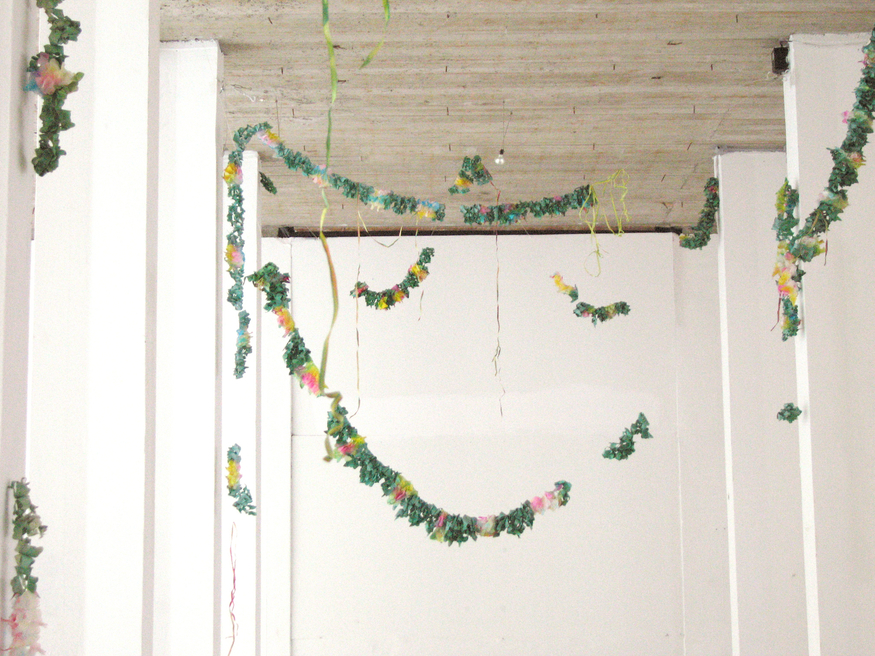 Amalia Pica, Final de Fiesta, (2005), colour photograph of paper garlands, installation view. Courtesy the artist, Gallery Diana Stigter, Amsterdam and Herald St, London