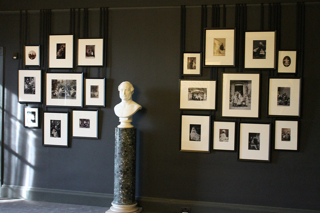 The Mourning Room, devoid of colour, still features very elegant and creative displays. Here's a bust of Albert, surrounded by family portraits and photographs
