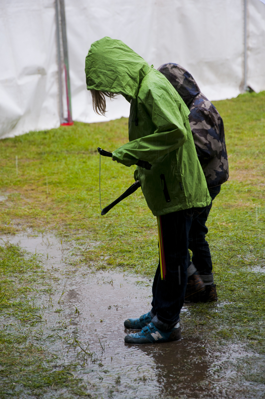 Revellers enjoy the Applecart Festival in Victoria Park, Hackney, East London in the rain.