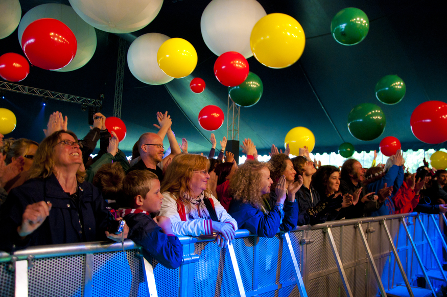 Revellers enjoy the Applecart Festival in Victoria Park, Hackney, East London in the rain.