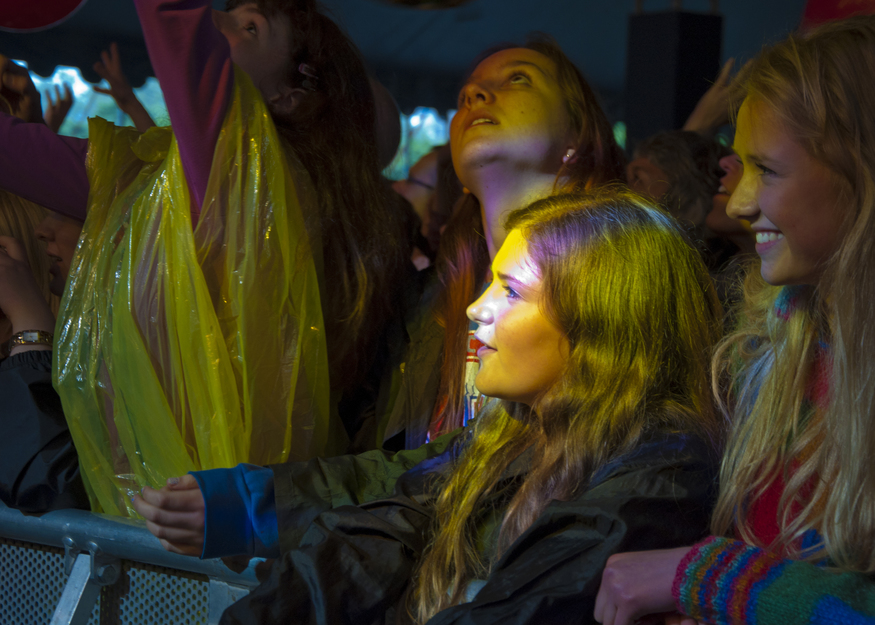 Revellers enjoy the Applecart Festival in Victoria Park, Hackney, East London in the rain.