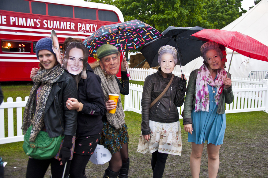 Revellers enjoy the Applecart Festival in Victoria Park, Hackney, East London in the rain.