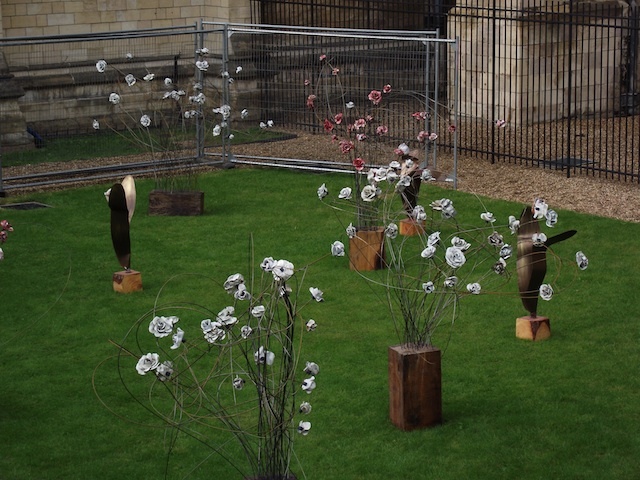 The ceramic installation of roses and tulips created by artist Paul Cummins