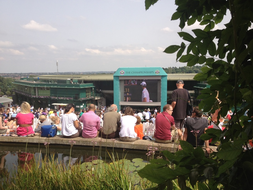 Spectators watching the big screen on Henman Hill / Murray's Mound