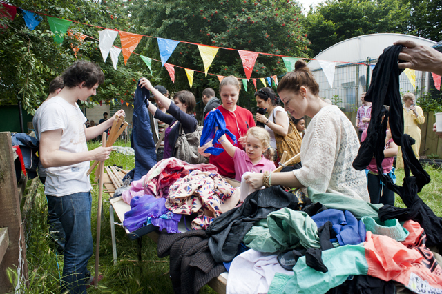 Choosing the outfits for the scarecrows.