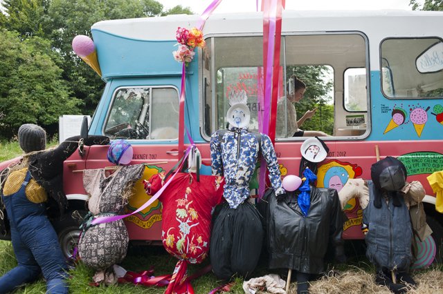 The scarecrows and the van.