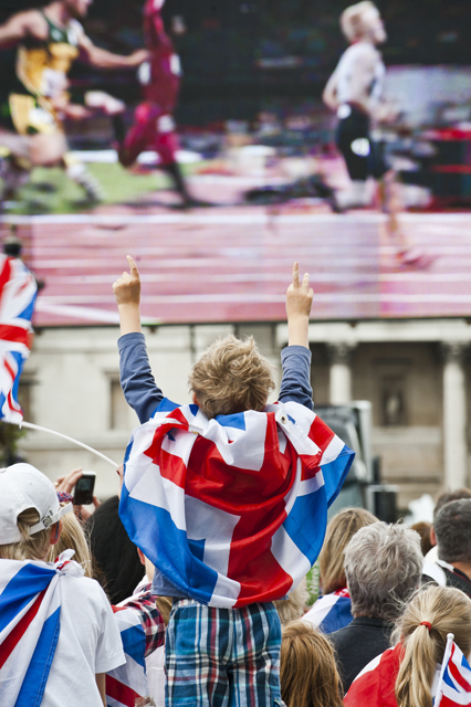 A fan cheers the big screen. (Jose Farinha)