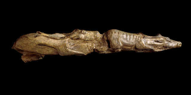 33738: Tip of a mammoth tusk carved as two reindeer depicted one behind the other; 13,000 years old approximately; Montastruc, France; Copyright of The Trustees of the British Museum